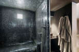 Step into luxury with this stunning bathroom featuring a sleek, modern design.