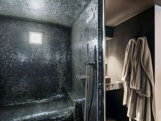 Step into luxury with this stunning bathroom featuring a sleek, modern design.