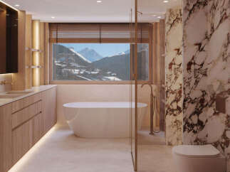 Indulge in luxury with this stunning bathroom featuring a freestanding tub and breathtaking mountain views.