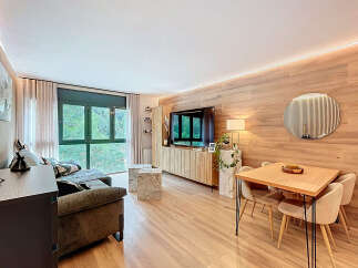 Discover modern living in this stylish property, featuring a beautifully designed living room with a sleek entertainment unit and a cozy seating area.