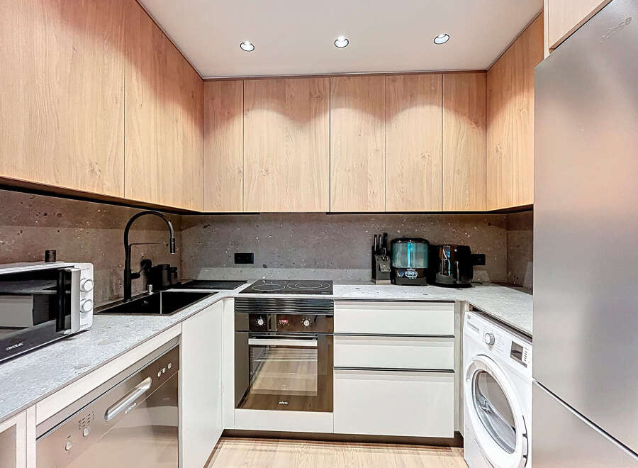 This modern kitchen boasts sleek design and functionality.