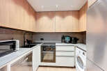 This modern kitchen boasts sleek design and functionality.