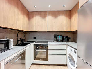 This modern kitchen boasts sleek design and functionality.