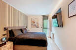 This stunning bedroom boasts a modern design with a luxurious feel.