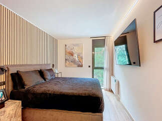 This stunning bedroom boasts a modern design with a luxurious feel.
