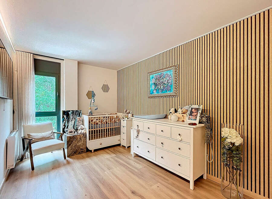 This charming nursery offers a serene and stylish space for your little one.
