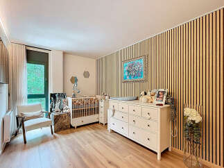 This charming nursery offers a serene and stylish space for your little one.