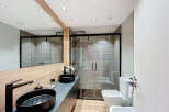 Step into modern luxury with this stunning bathroom design.