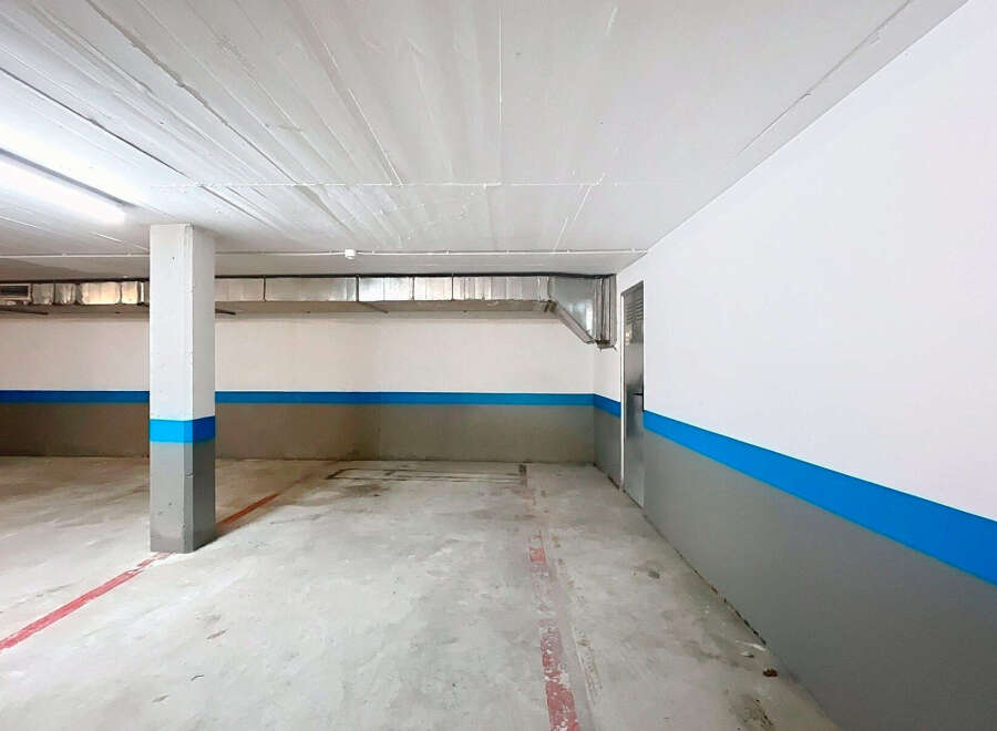 Discover the potential of this spacious parking garage, perfect for secure vehicle storage.
