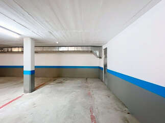 Discover the potential of this spacious parking garage, perfect for secure vehicle storage.