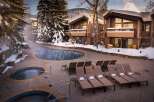 Experience luxury and relaxation at this stunning property featuring a heated outdoor pool and hot tubs, perfect for unwinding after a day of skiing or exploring.