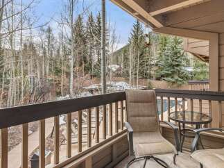 Enjoy breathtaking mountain views from this charming balcony.