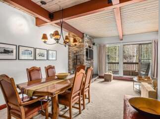 Step into luxury with this stunning property, featuring a beautifully designed dining area perfect for hosting gatherings.