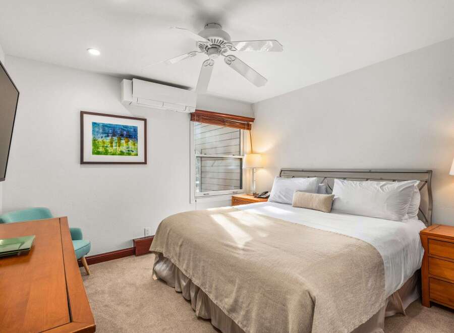 This cozy bedroom offers a comfortable retreat with its inviting ambiance.