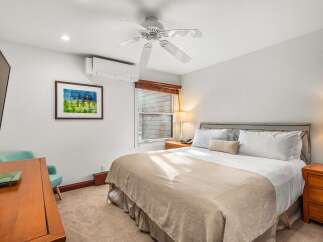 This cozy bedroom offers a comfortable retreat with its inviting ambiance.