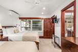 Step into this inviting bedroom, featuring two comfortable beds perfect for a relaxing stay.