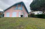 Discover this charming pink house with a unique architectural design.