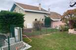 Discover this charming property featuring a well-maintained exterior and a lush green lawn, perfect for outdoor enjoyment.