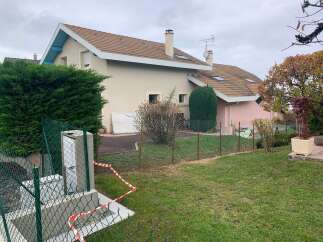Discover this charming property featuring a well-maintained exterior and a lush green lawn, perfect for outdoor enjoyment.