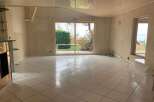 Discover the potential of this spacious property with its bright, tiled floors and ample natural light.