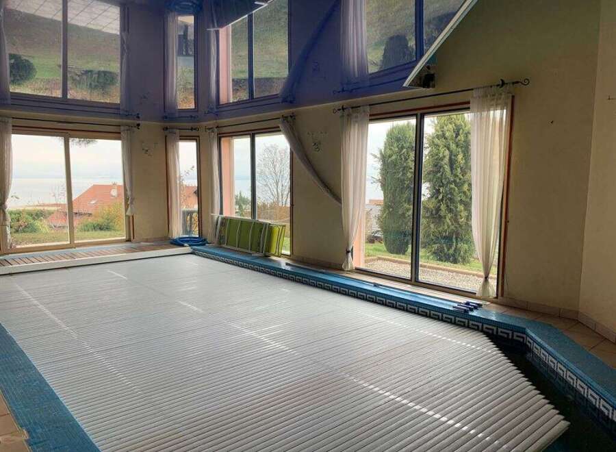 This stunning property boasts an indoor pool, perfect for year-round enjoyment.