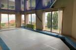 This stunning property boasts an indoor pool, perfect for year-round enjoyment.