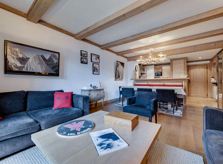 Experience luxury living in this stunning property, featuring a cozy living room with a comfortable sofa and a stylish coffee table.