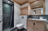 This stunning bathroom boasts a luxurious design with a modern touch.
