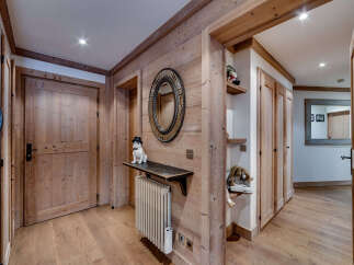 Step into this inviting entryway, showcasing a blend of rustic charm and modern design.