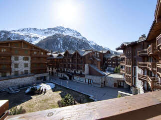 Discover the charm of this stunning mountain property, featuring exquisite wooden architecture and stone accents.