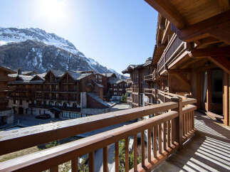 Experience the charm of mountain living in this stunning property, showcasing exquisite wooden architecture and breathtaking views.