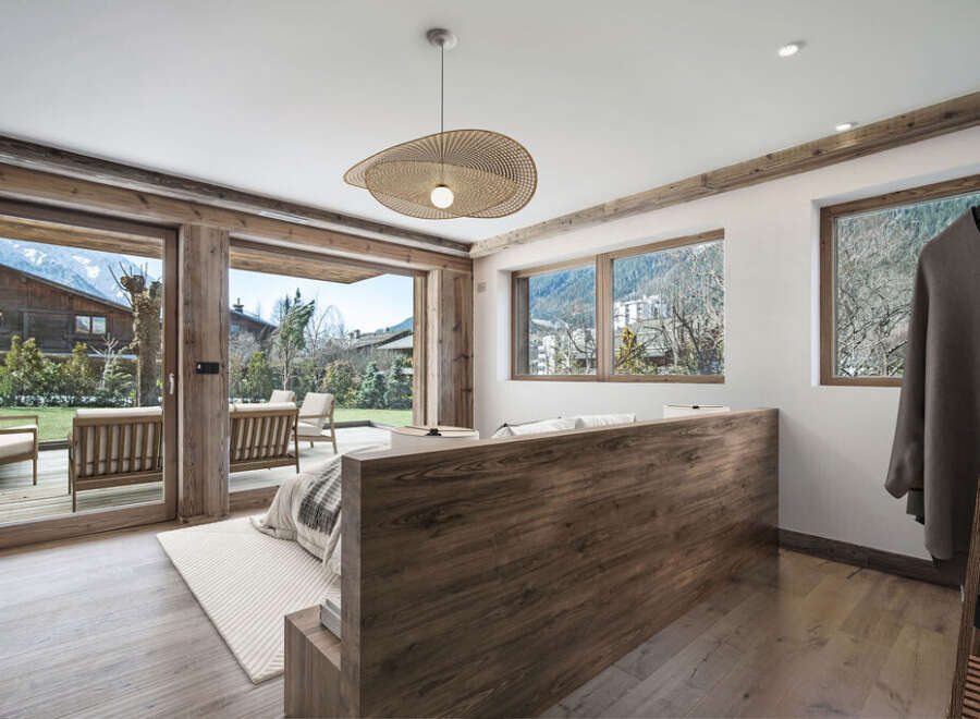 Experience luxury living in this stunning property, featuring a spacious bedroom with breathtaking views.