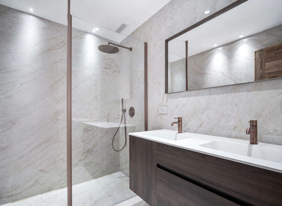Step into luxury with this stunning bathroom featuring a sleek, modern design.