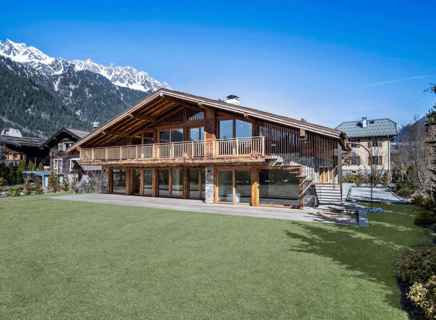 This stunning chalet-style home offers a luxurious mountain retreat with breathtaking views.