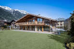 This stunning chalet-style home offers a luxurious mountain retreat with breathtaking views.