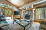 Step into luxury with this stunning living room featuring a cozy fireplace and a sleek TV setup.