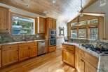Step into this stunning kitchen, boasting beautiful wooden cabinetry and a warm, inviting atmosphere.