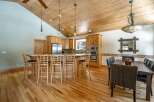 This stunning kitchen boasts a warm and inviting atmosphere, perfect for both everyday living and entertaining.