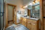 This stunning bathroom boasts a luxurious vanity with granite countertops and ample storage.