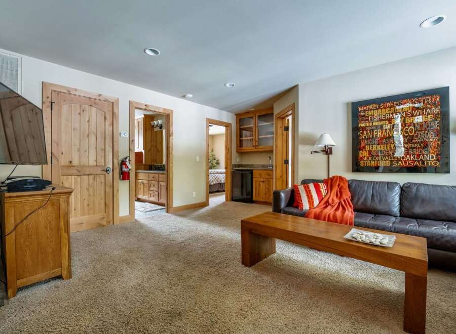 This inviting living space features a comfortable leather sofa, perfect for relaxing after a long day.