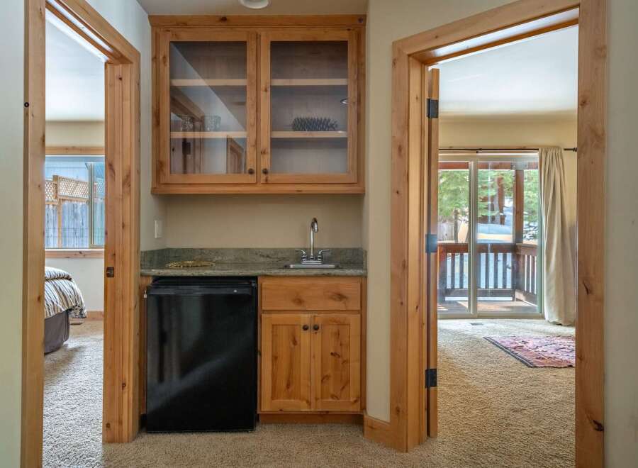 Discover the charm of this beautifully designed property, featuring a convenient wet bar area perfect for entertaining.