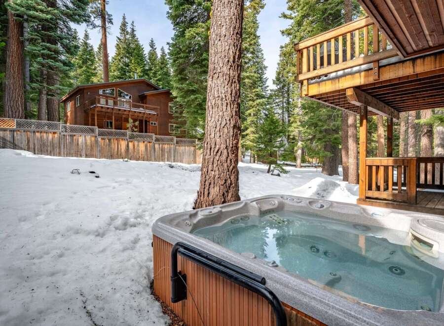 Enjoy a relaxing getaway in this stunning property featuring a luxurious hot tub, perfect for unwinding after a day of outdoor adventures.