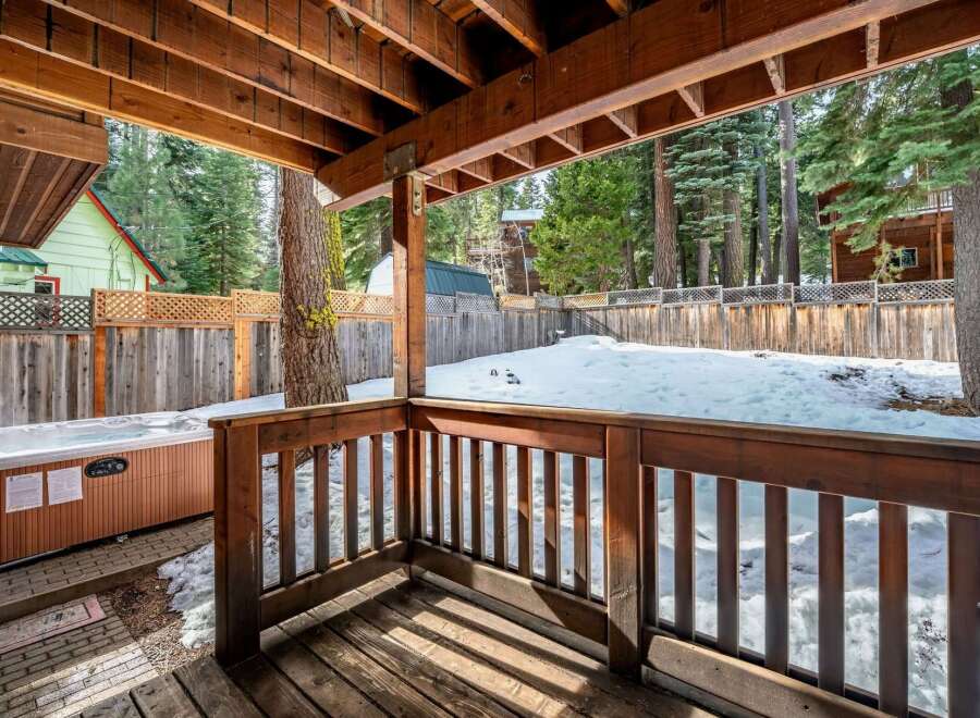 Enjoy the tranquility of this stunning property with a private deck and hot tub, perfect for relaxation.