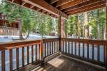 Enjoy the serene beauty of this stunning property, featuring a spacious deck that offers breathtaking views of the surrounding forest.
