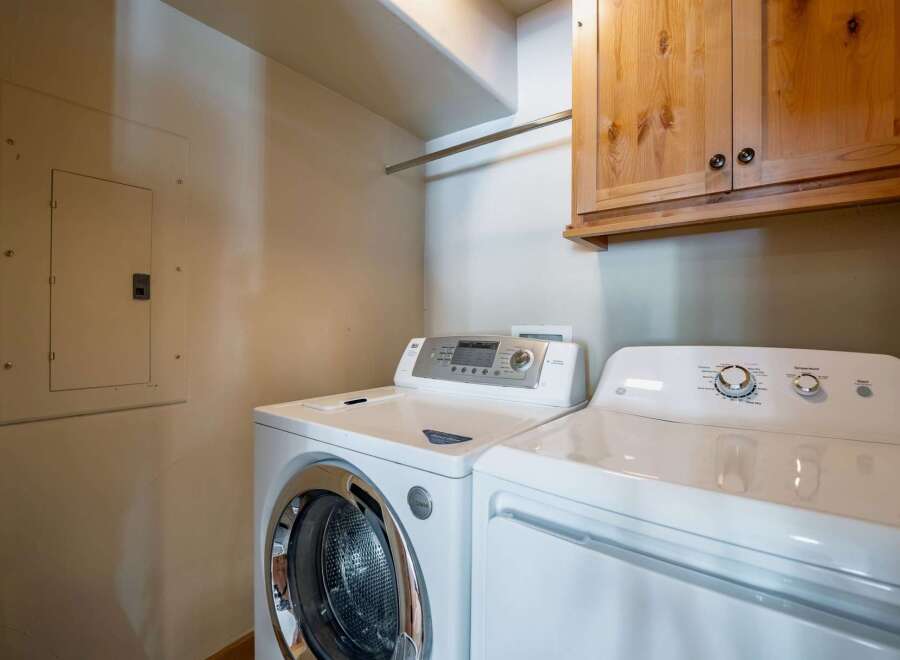 This laundry room features a modern washer and dryer set, perfect for efficient home management.