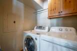 This laundry room features a modern washer and dryer set, perfect for efficient home management.