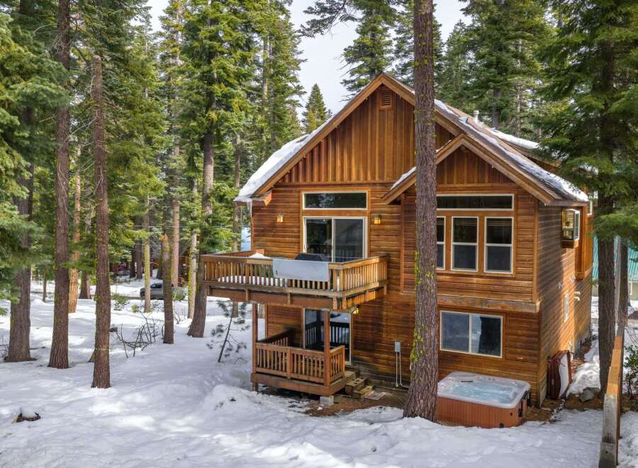 Nestled in a serene, snow-covered forest, this stunning wooden cabin offers a perfect blend of rustic charm and modern comfort.