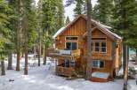 Nestled in a serene, snow-covered forest, this stunning wooden cabin offers a perfect blend of rustic charm and modern comfort.