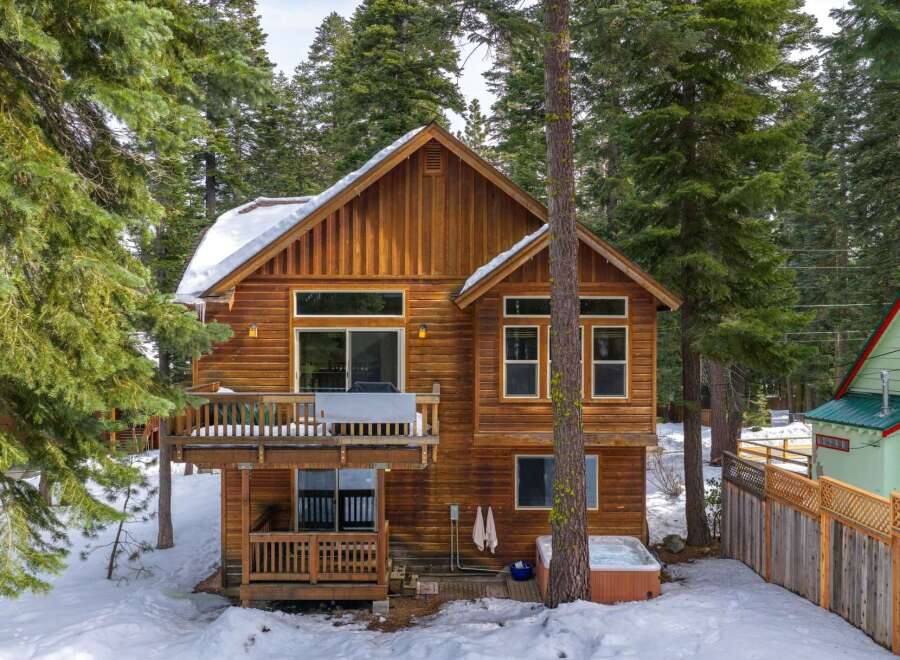 Nestled amidst a serene, snow-covered landscape, this charming wooden cabin offers a perfect blend of rustic charm and modern comfort.