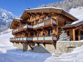 Experience the epitome of alpine luxury in this stunning wooden chalet.